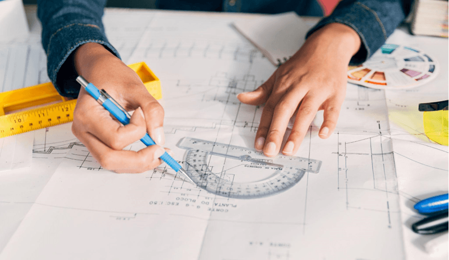 Architect drawing technical drawings