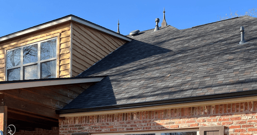 Seamless gutters along a residential roofline