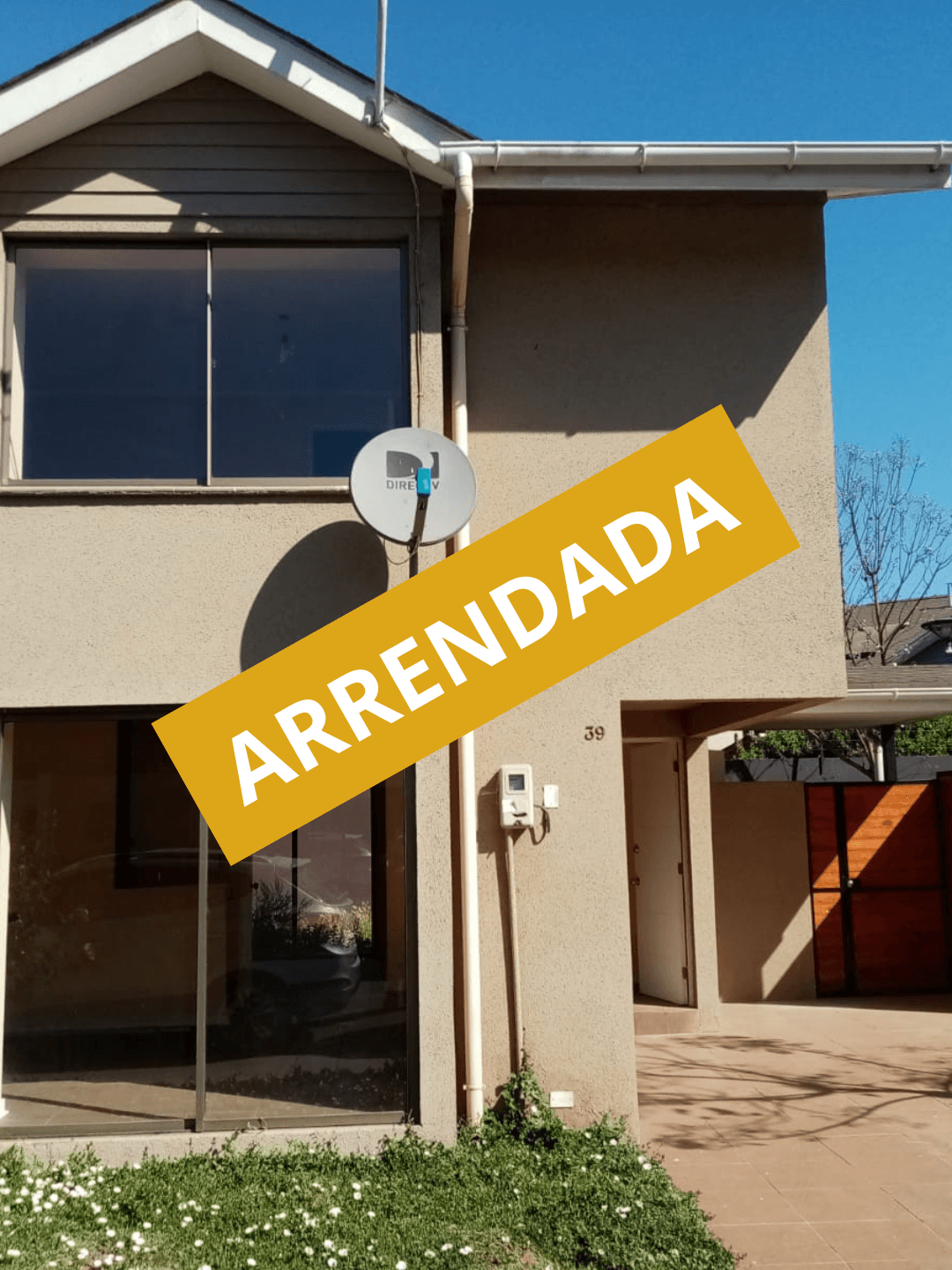 Stone church steeple rising above traditional half-timbered houses.