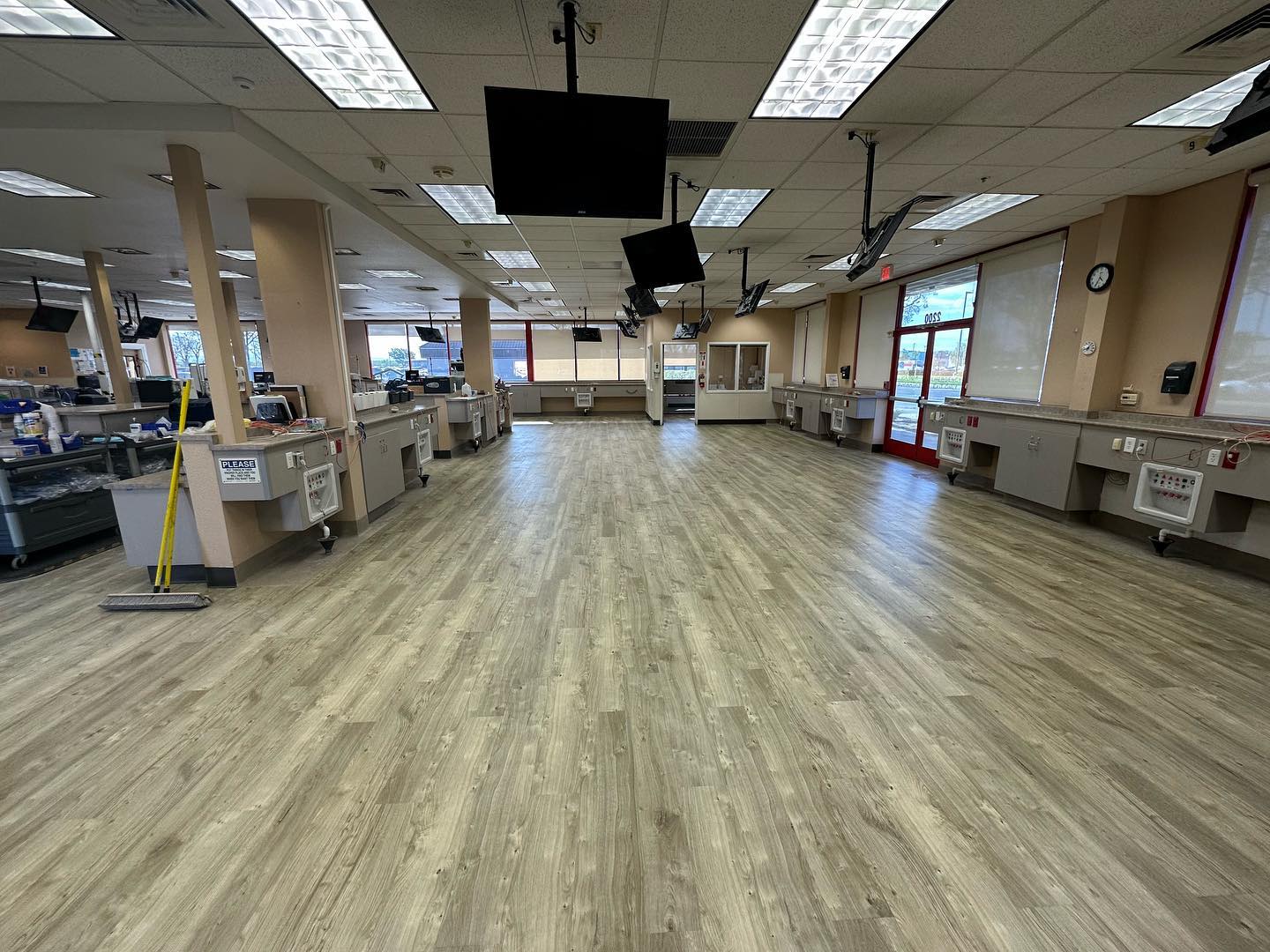 Completed LVP floor running the full width of a commercial service area
