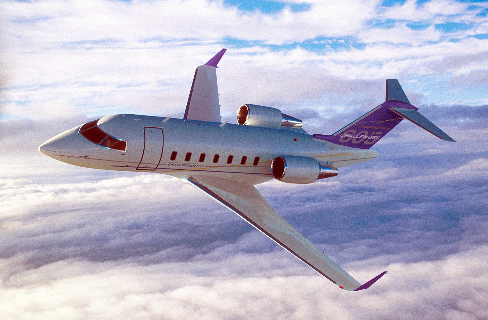 The Bombardier Challenger 605 is a large, long-range business jet that was introduced in 2006 as a successor to the Challenger 604. It has a maximum range of 4,000 nautical miles (7,408 km) and can carry up to 12 passengers.     The Challenger 605 is powered by two General Electric CF34-3B turbofan engines, each producing 8,729 pounds of thrust. It has a maximum cruise speed of Mach 0.80 and can fly at a maximum altitude of 41,000 feet.     The cabin of the Challenger 605 is spacious and comfortable, with a length of 28.4 feet, width of 8.2 feet, and height of 6.1 feet. It typically features a forward galley, a separate lavatory, and a range of seating configurations, including a three-seat divan.      The cabin can be configured to accommodate up to 12 passengers, with the option of adding an additional seat or a crew rest area.     The avionics suite on the Challenger 605 includes a Collins Pro Line 21 system, which features four large displays and a range of advanced navigation and communication capabilities.   Other features include an Enhanced Ground Proximity Warning System (EGPWS), a Traffic Collision Avoidance System (TCAS II), and weather radar.     Overall, the Challenger 605 is a reliable and comfortable aircraft that is well-suited for long-range flights and can accommodate a range of passenger and crew needs.