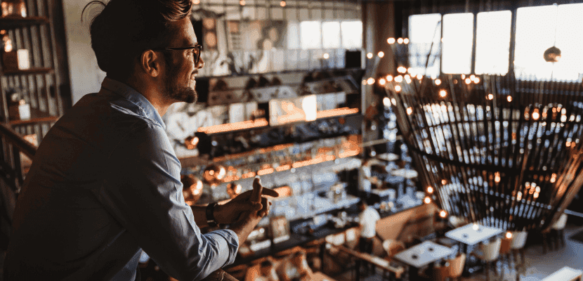 Restaurant manageer looking out at his establishment