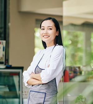 husband and wife working happily on a laptop