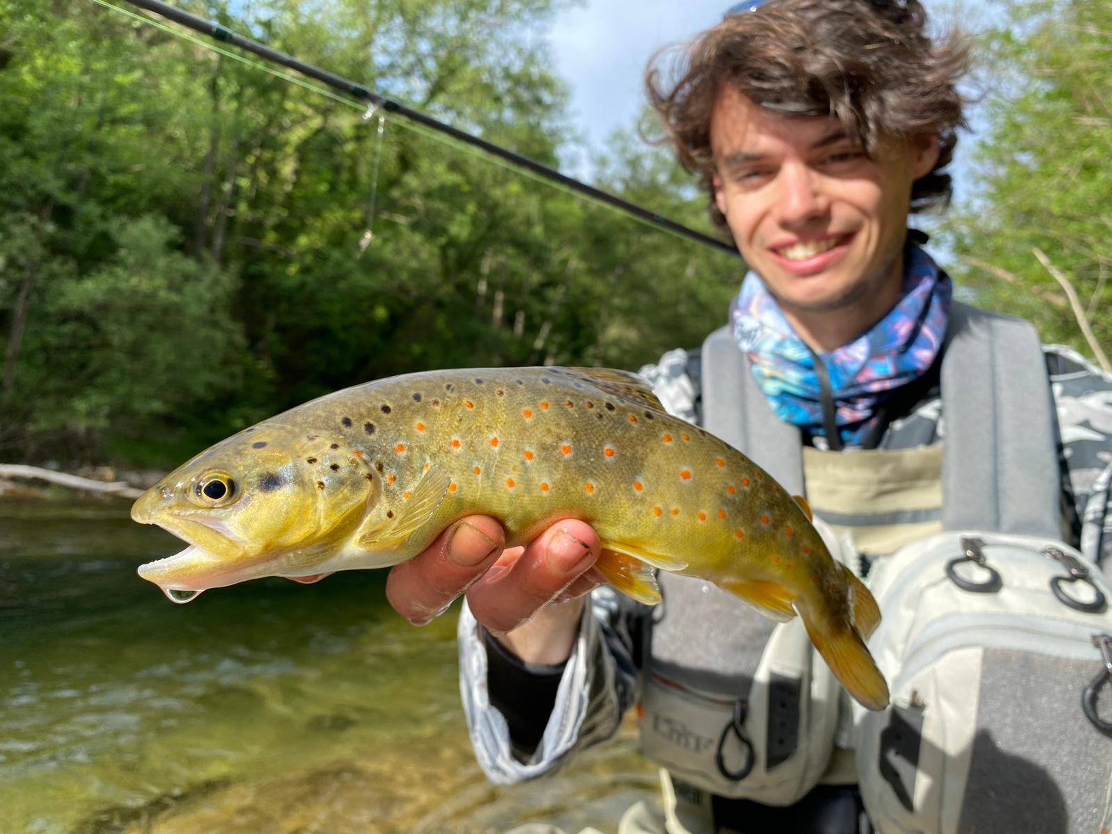 Hiker and angler enjoying a multi-day adventure in the Pyrenees, combining trekking with world-class fly fishing near Barcelona.