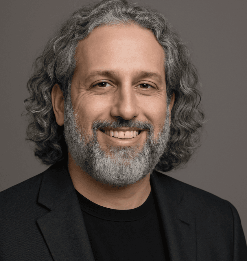 Portrait of a person in dark clothing speaking on a phone