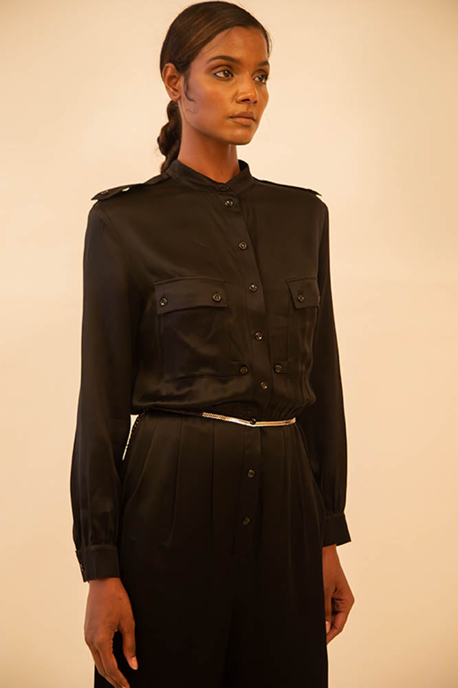 Vintage YSL black button-up jumpsuit featuring a tailored fit and classic detailing, sourced from global designer archives.