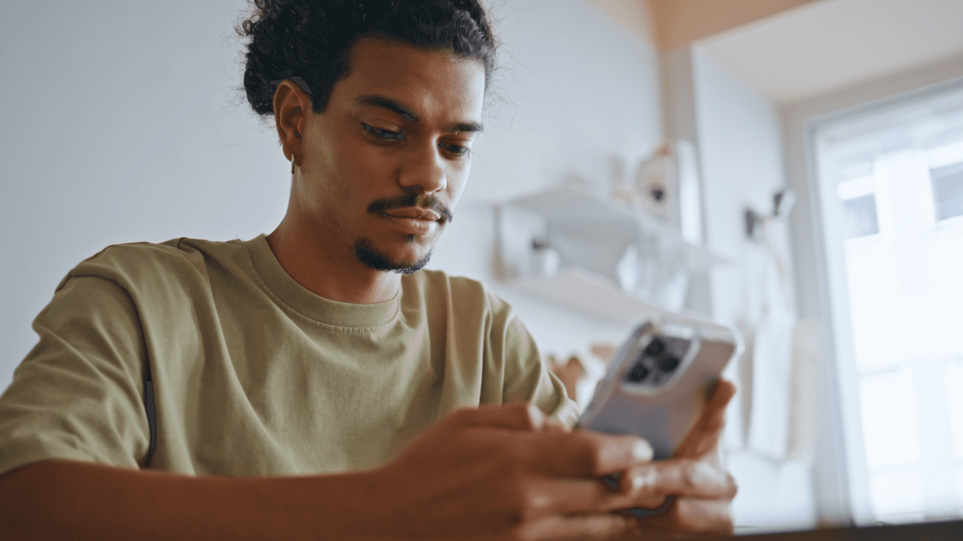 Man typing on a phone.