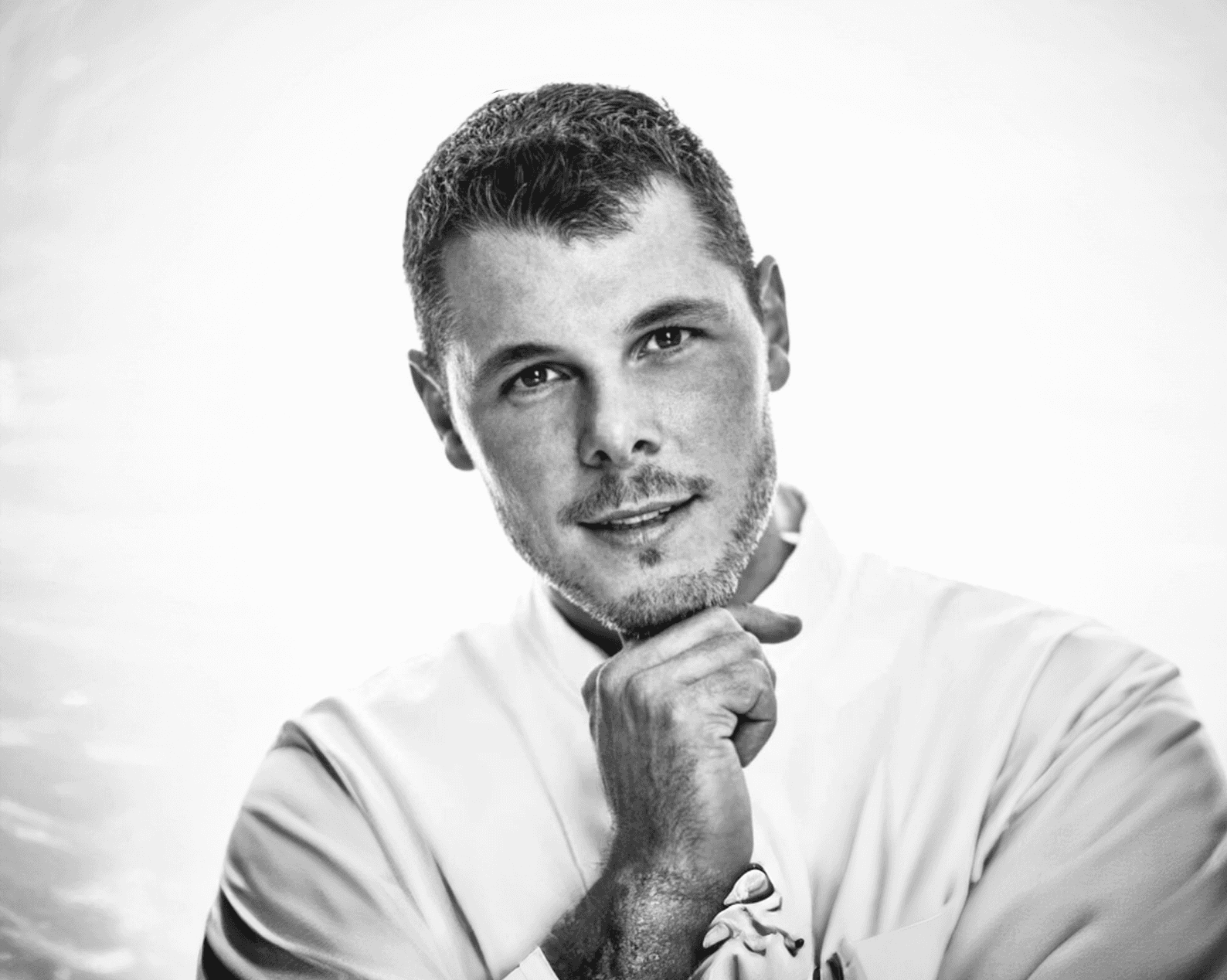 woman in black long sleeve shirt sitting on white couch