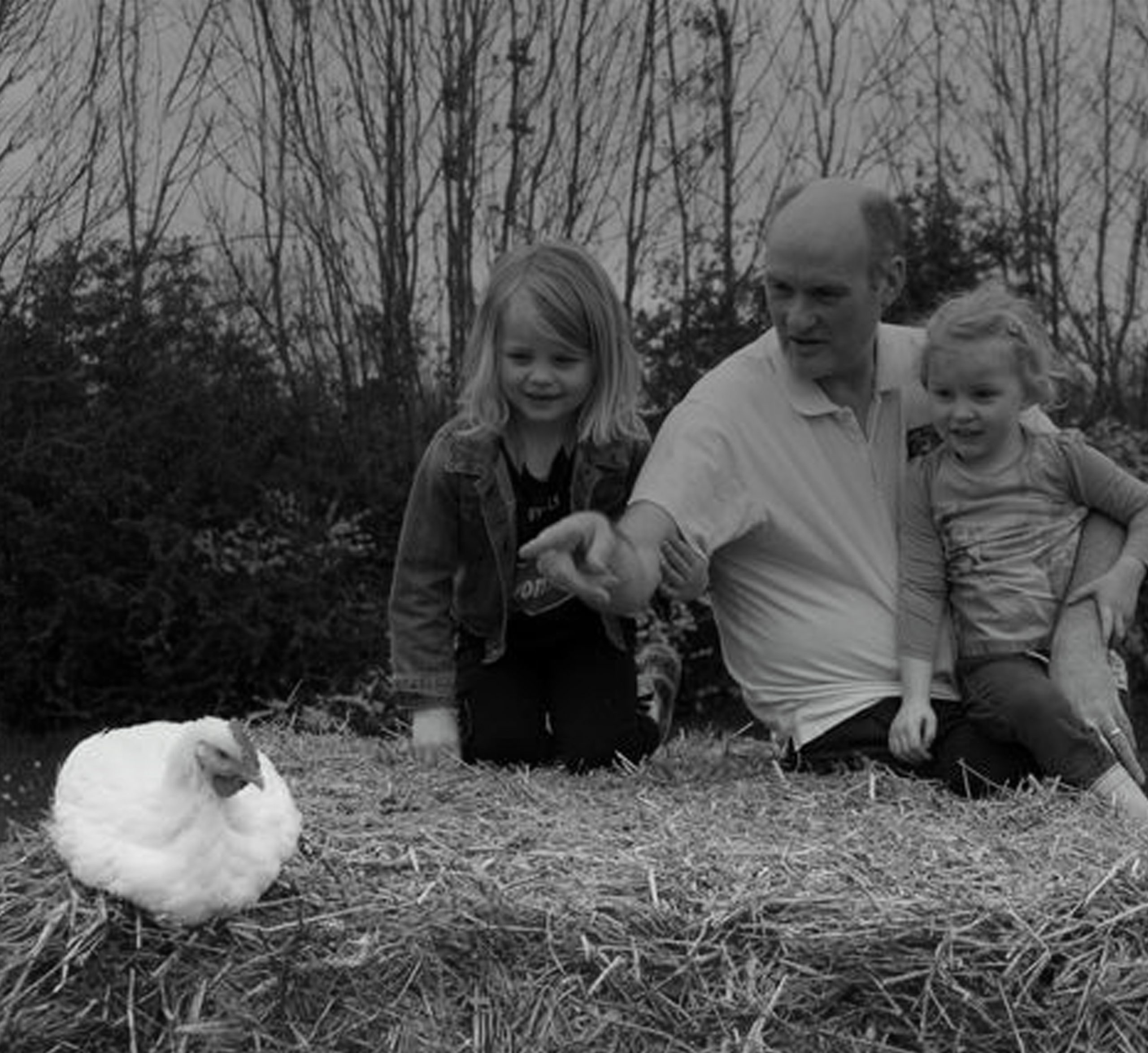 Owner of Rings Farm, sitting besides his chicken with his two daughers while supplying their goods to As One Restaurant Dubliln