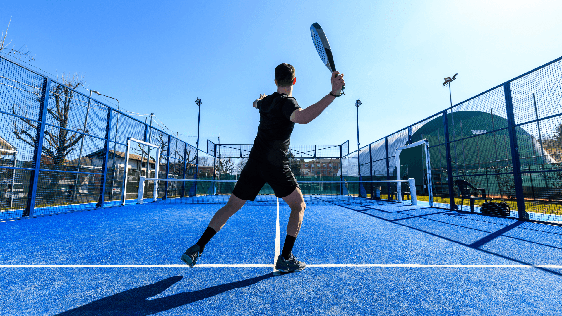 A man holding a paddle serving a ball