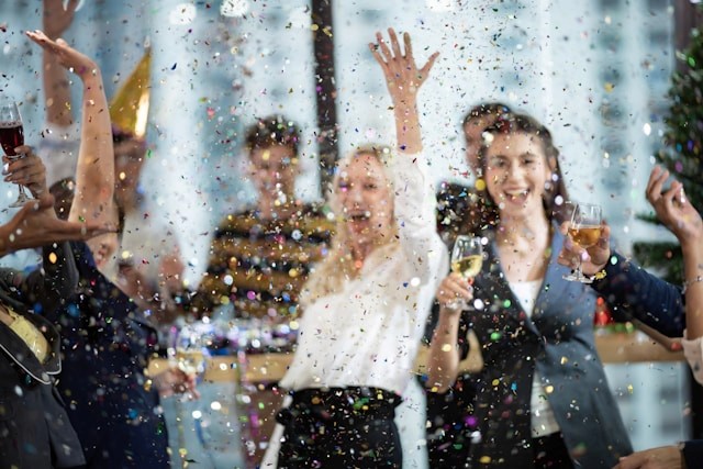 Girl throwing confetti into the air