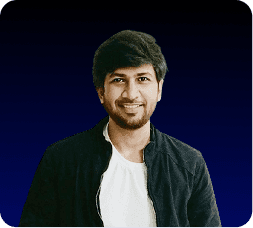 A young boy in formal attire looks forward.