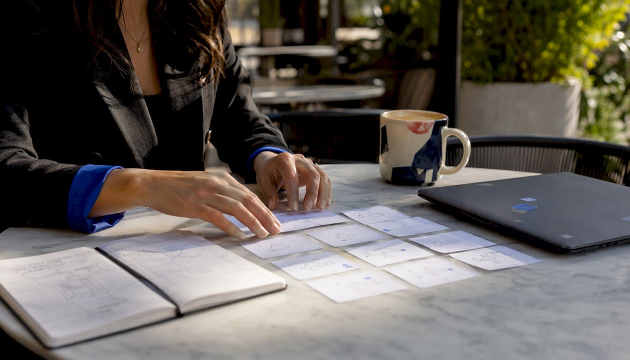 Hands arranging MVP cloud tools on table