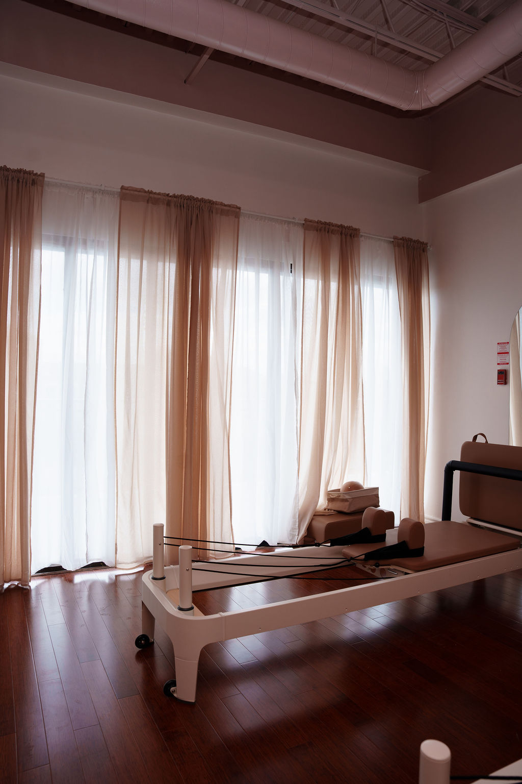 On St. Clair in Toronto, two women experiencing the best Mat and Reformer Pilates classes available