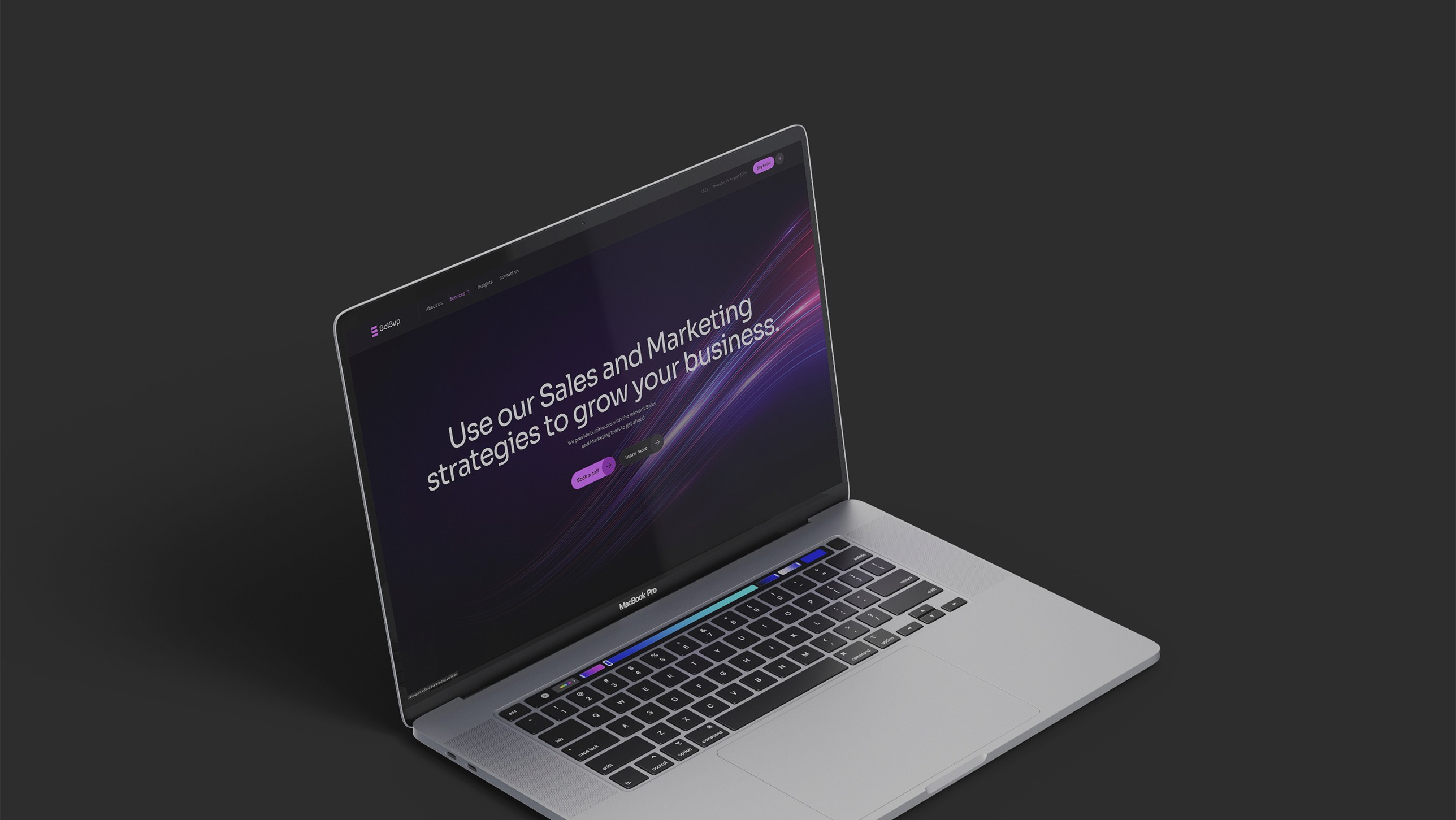 Laptop mockup of the website in a dark tone