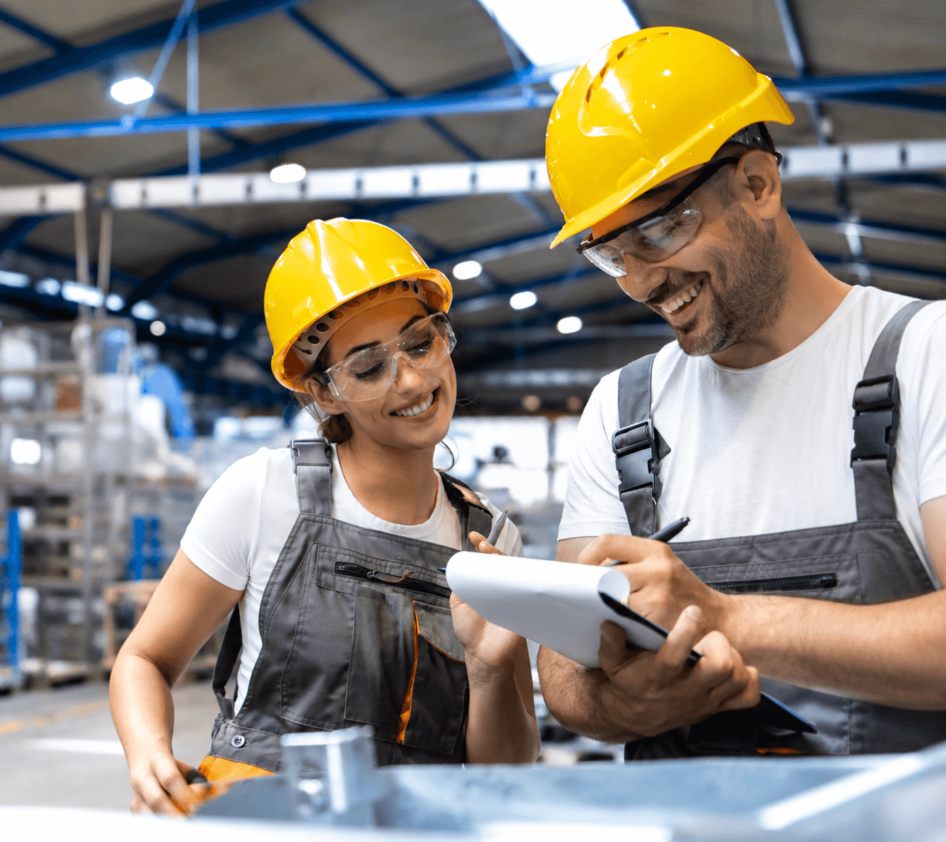 Manufacturing professionals reviewing production payments and financial workflows using automated payment software.