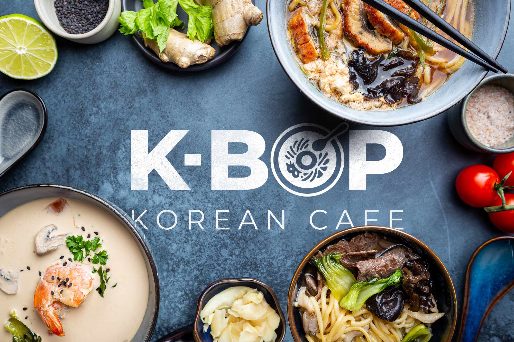 Food on a blue table surrounding K-BOP logo in white