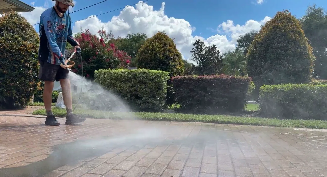 Technician wet sanding pavers