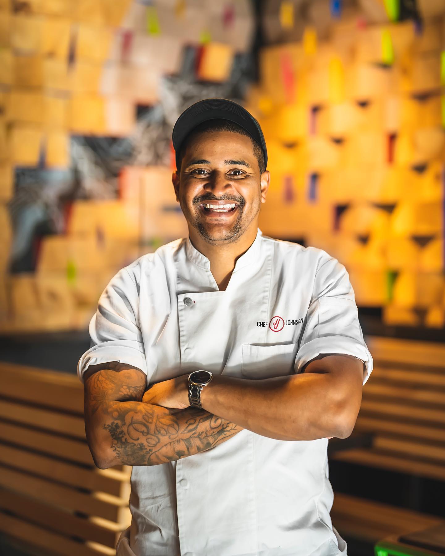 Chef JJ Johnson, award-winning chef and founder of FIELDTRIP, standing proudly in the kitchen. A leader in culinary innovation and advocate for rice as a cultural connector.