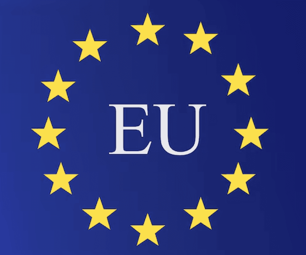 Wind turbine towering over agricultural fields