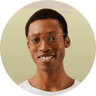 woman in white crew neck shirt smiling