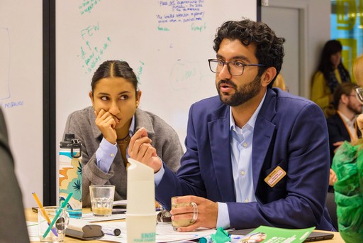 Close-up of a tree stump showing growth rings and a textured brown wood surface.