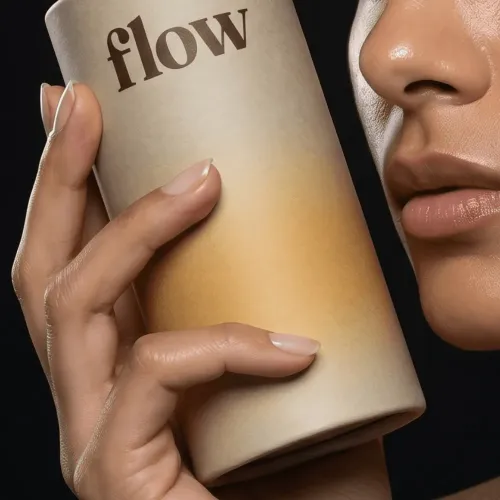 Hand holds "flow" product. A branding expert's artful design.