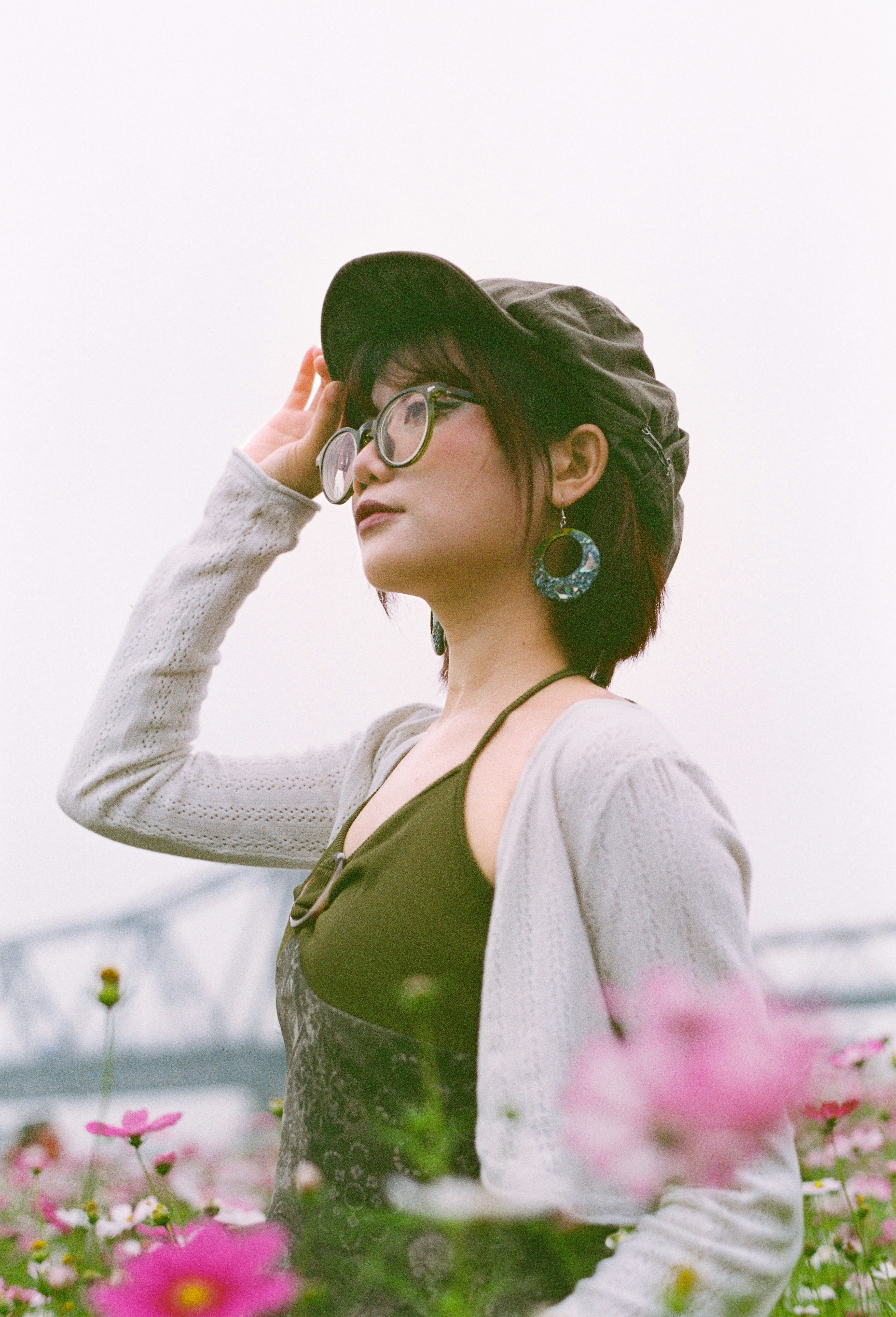 Woman in a field of flowers looking up
