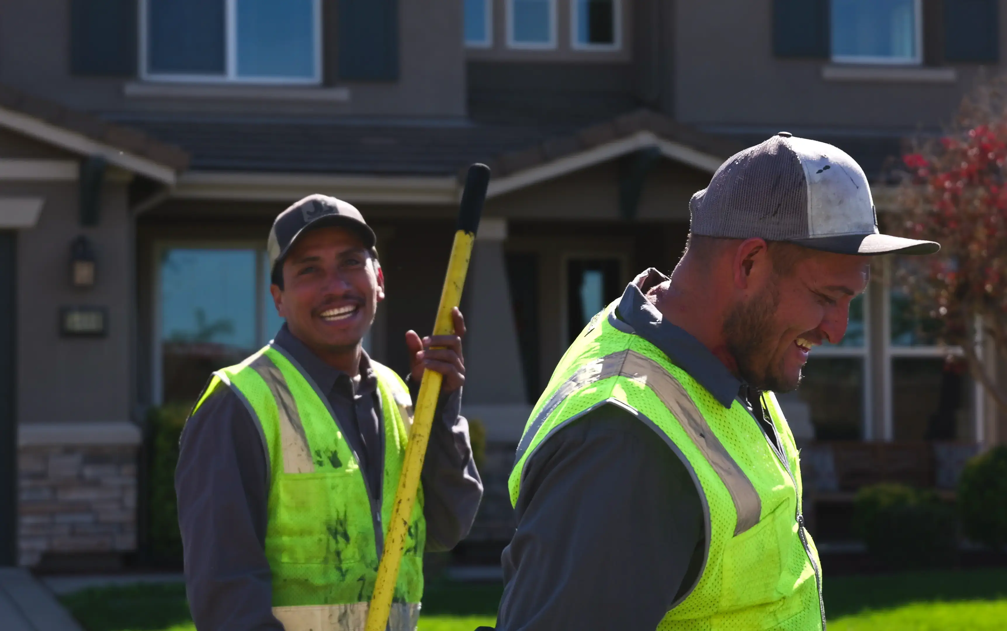 Smiling crew members having fun on a job