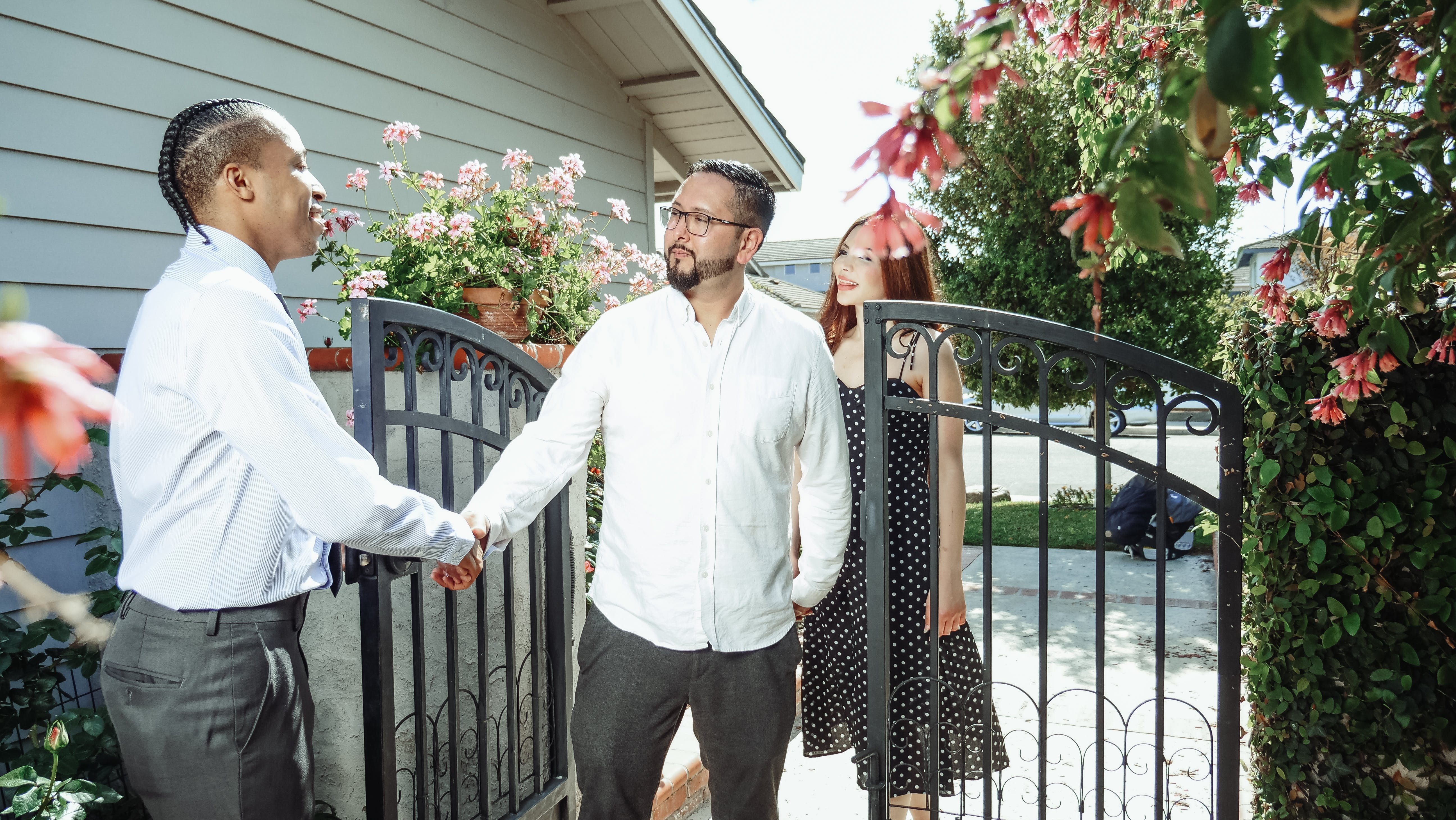 A mortgage broker shaking hands with his first client