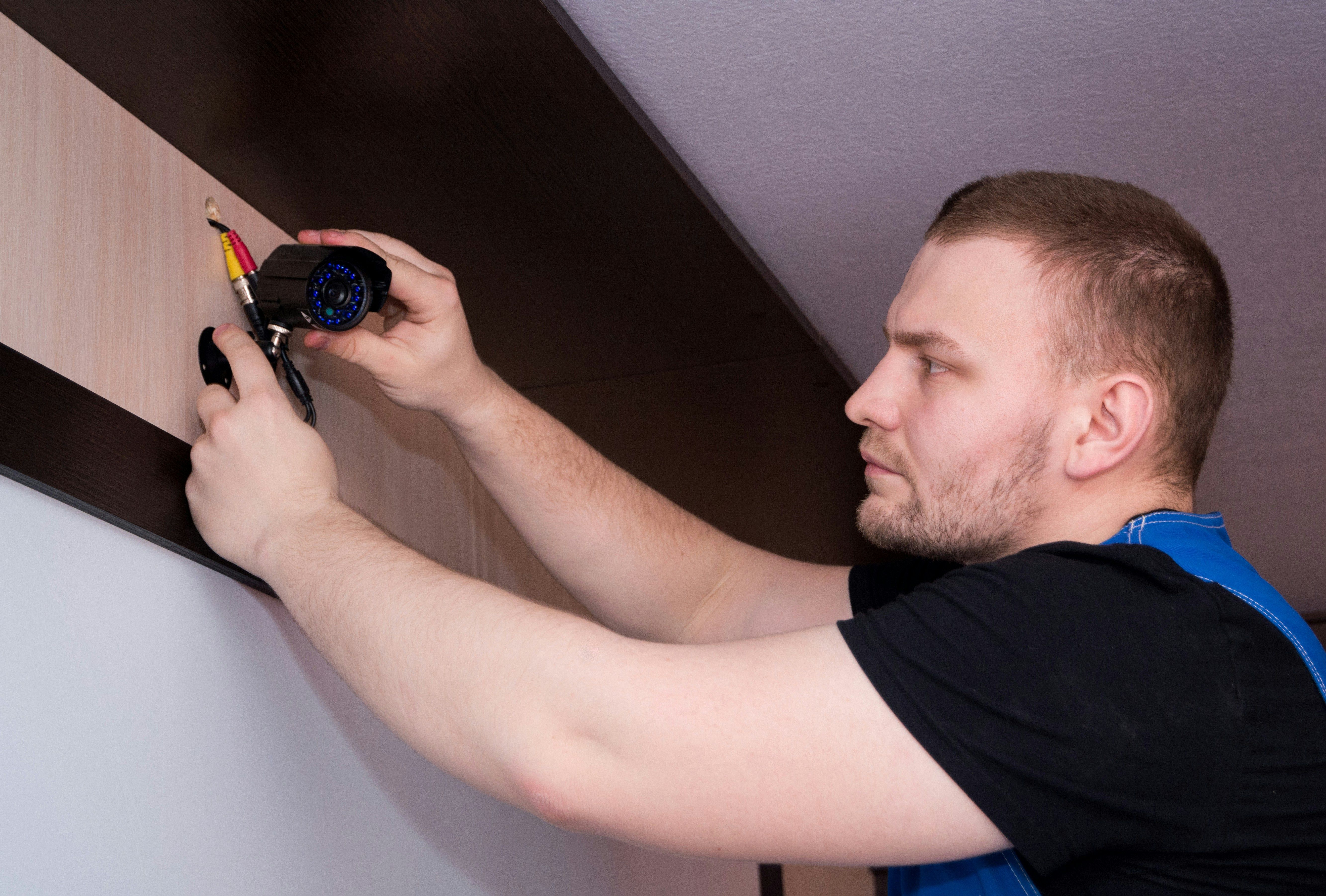 electrician installing camera