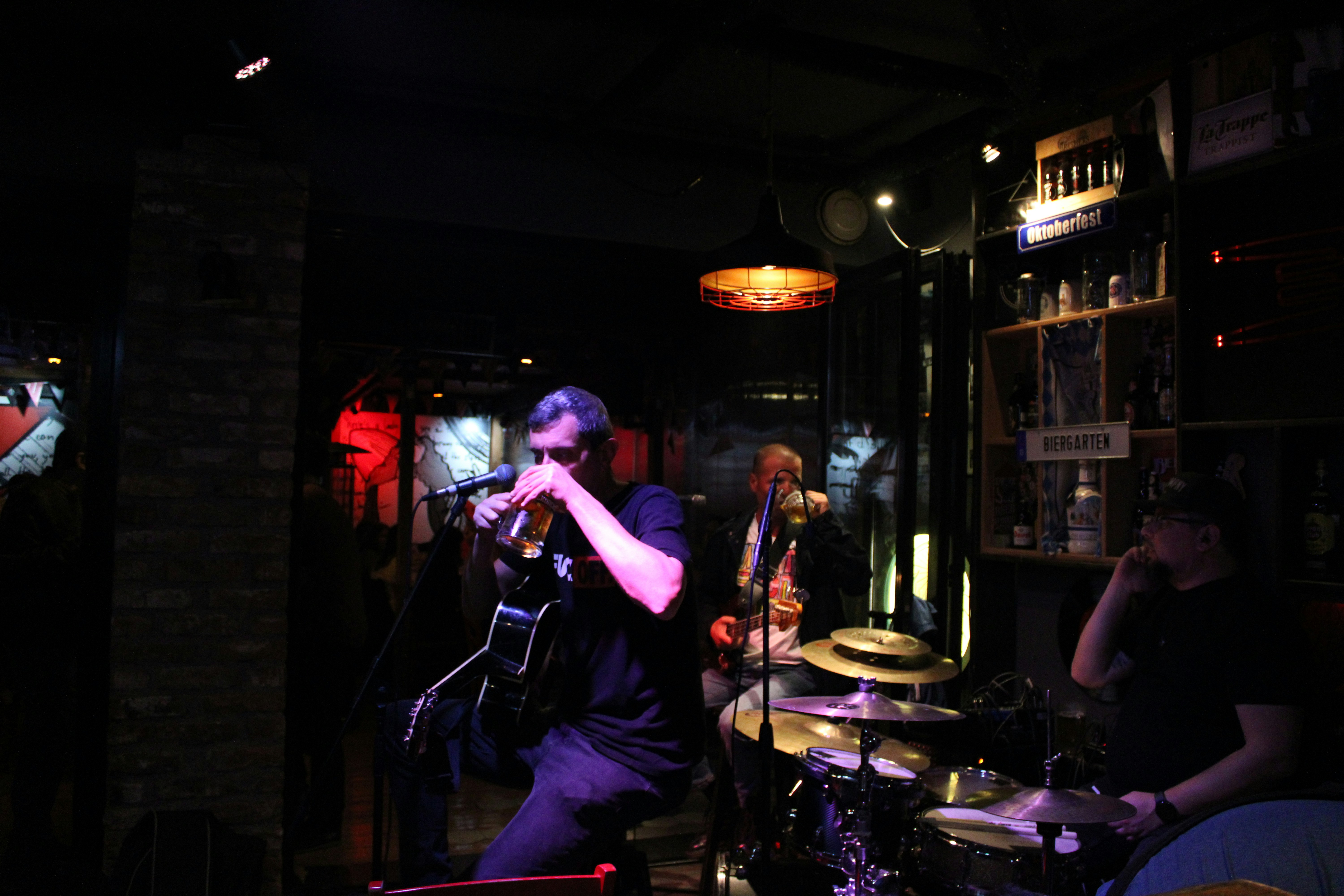 A band playing in a dimly lit room