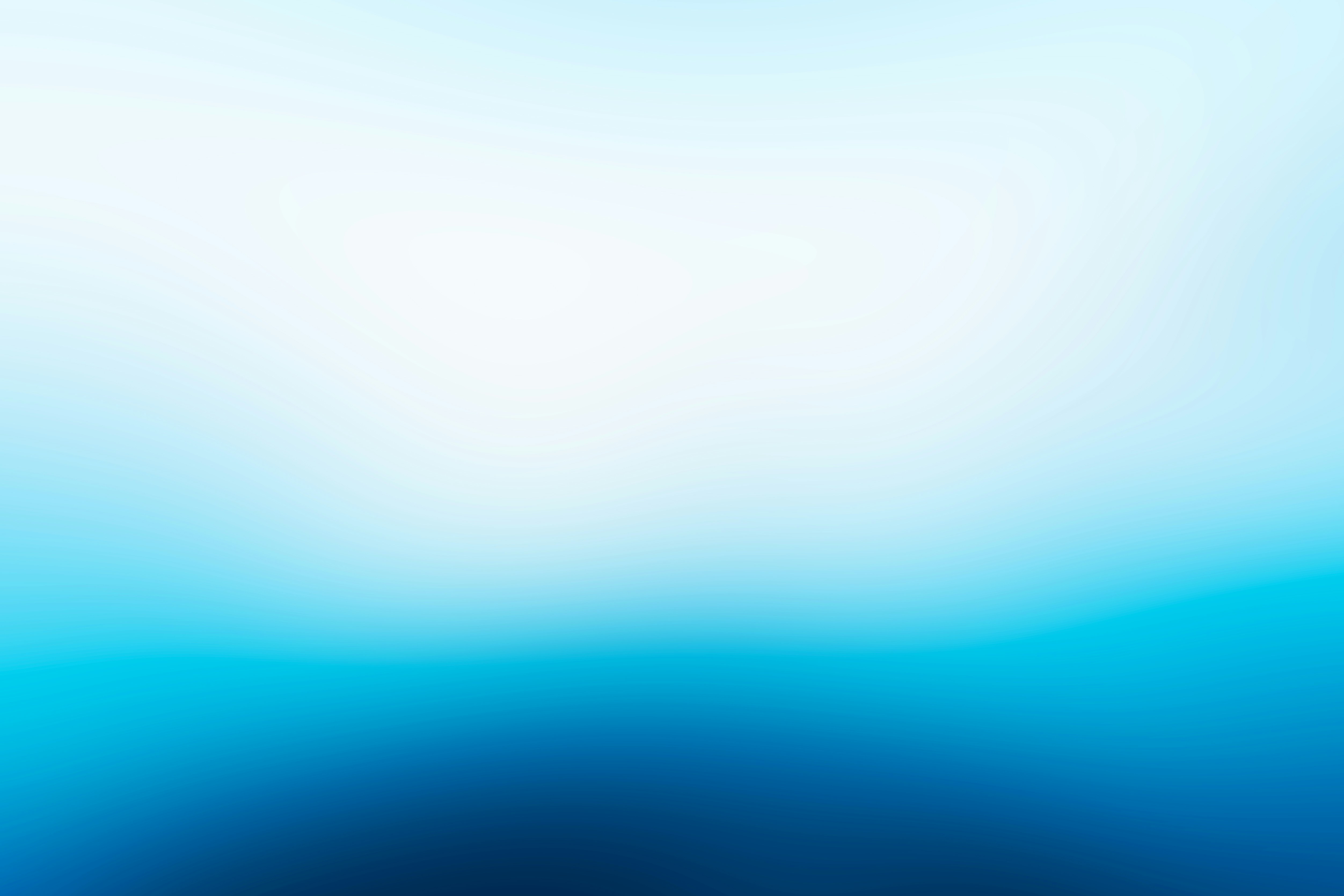 a blurry blue background with a white center