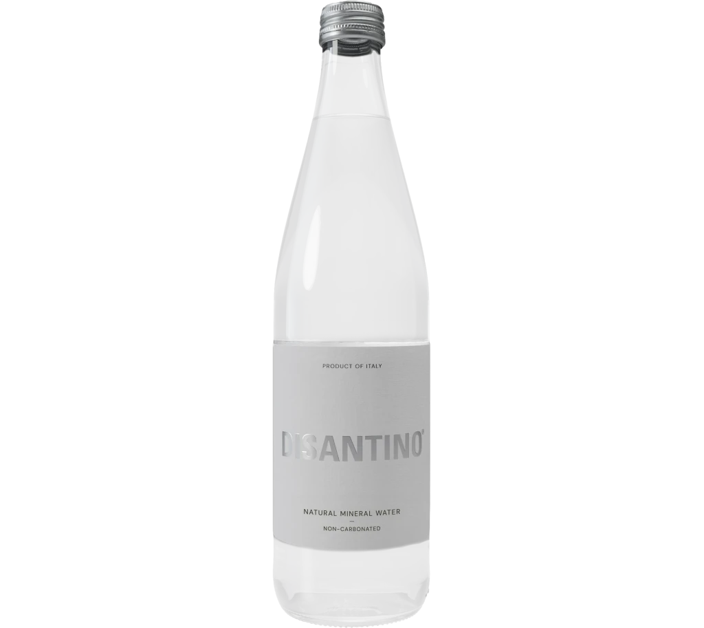 A 750ml clear glass bottle of Disantino Non-Carbonated Natural Mineral Water. The bottle has a light gray label with "DISANTINO" printed in a subtle silver-toned font. It features a silver screw cap and contains still, clear water.
