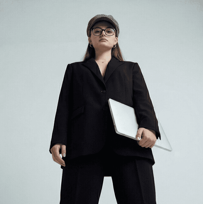 a woman in a dress sitting on a couch