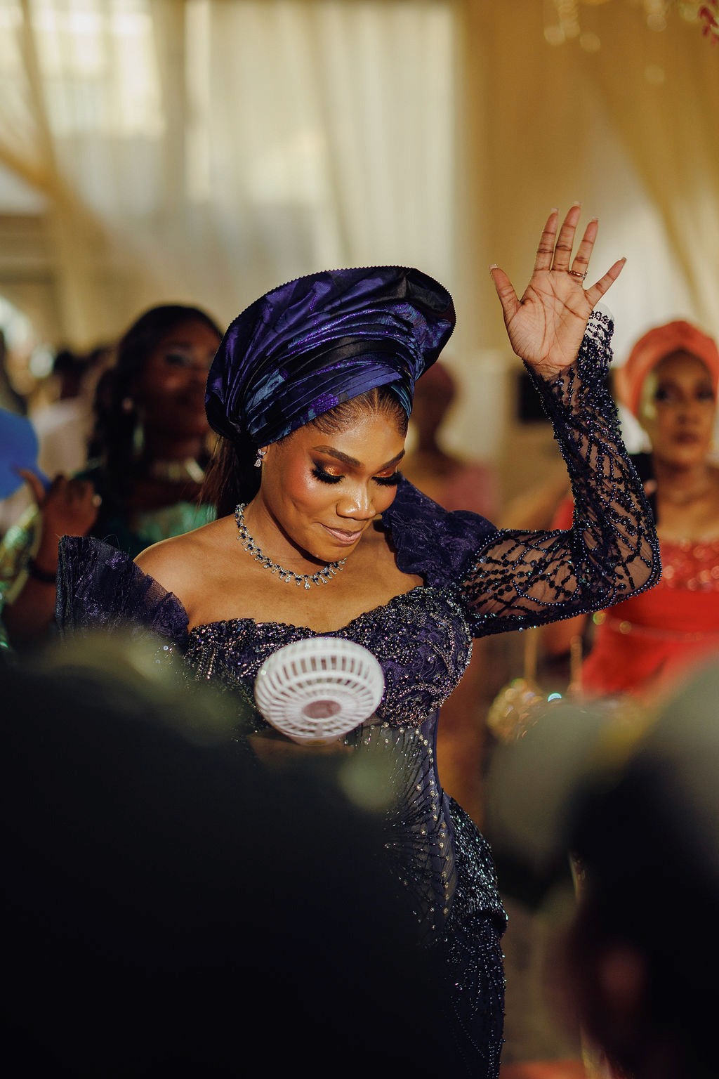 Bride and groom celebrating a luxury wedding coordinated by Victoria Brooks Events, a premium wedding planner in Nigeria. with family and friends