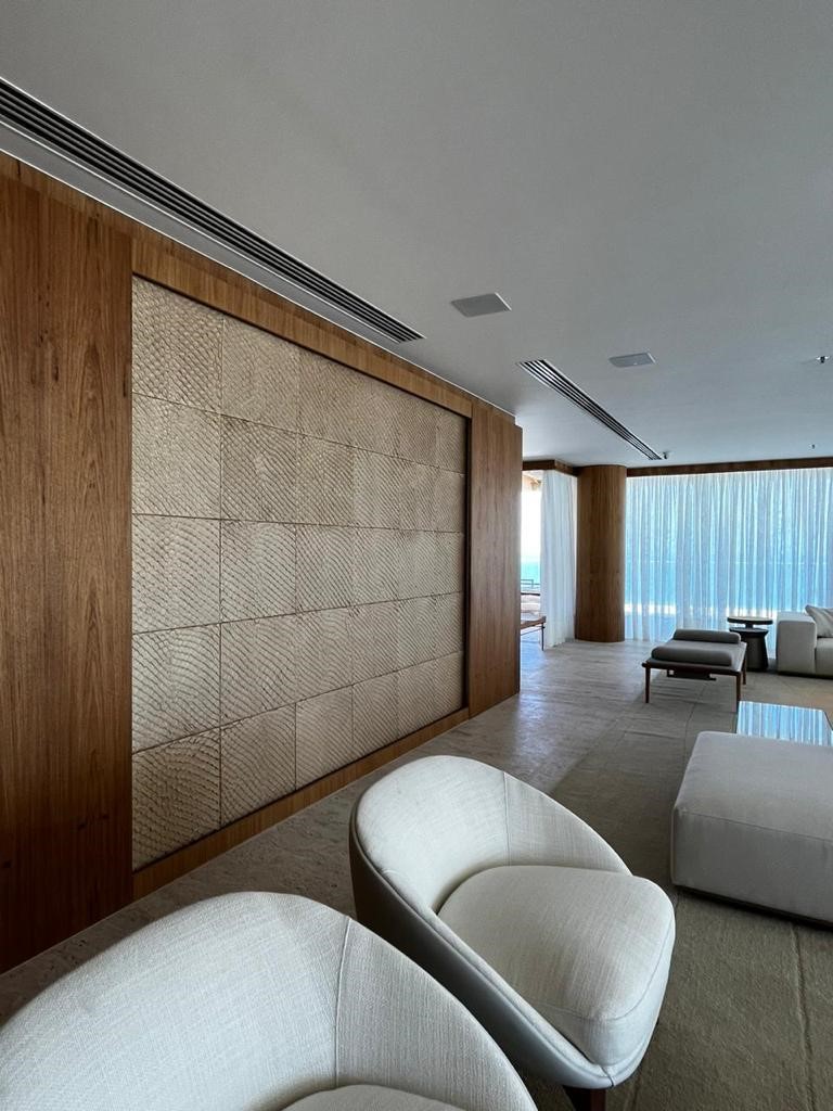 two people looking at a tablet and smiling