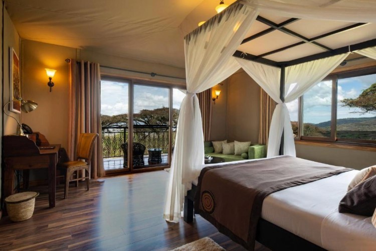 sunloungers fronting buildings near mountain