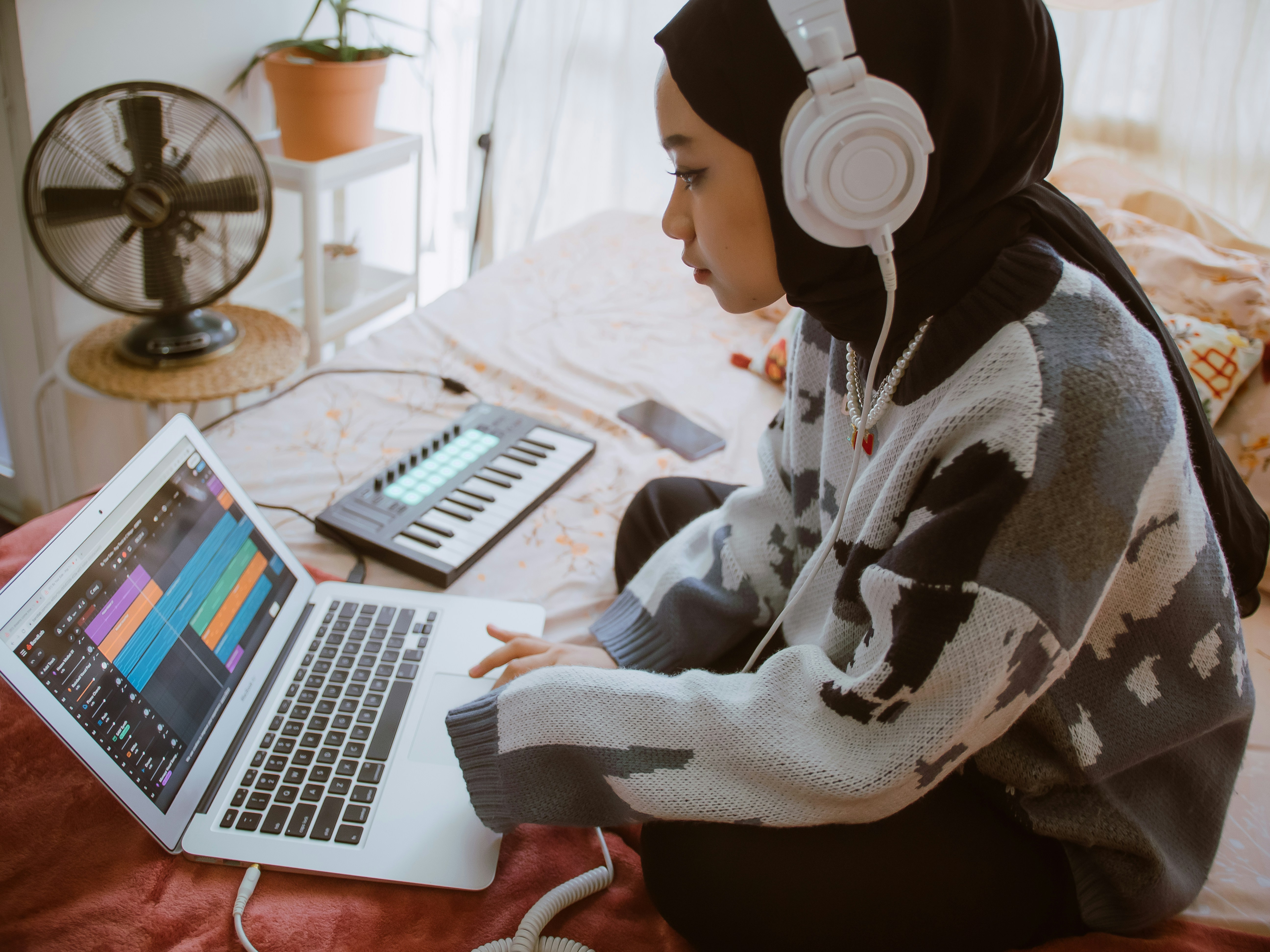 girl editing on macbook