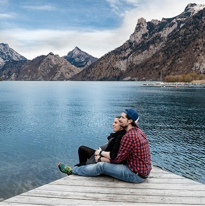 smiling woman wearing white and black pinstriped collared top