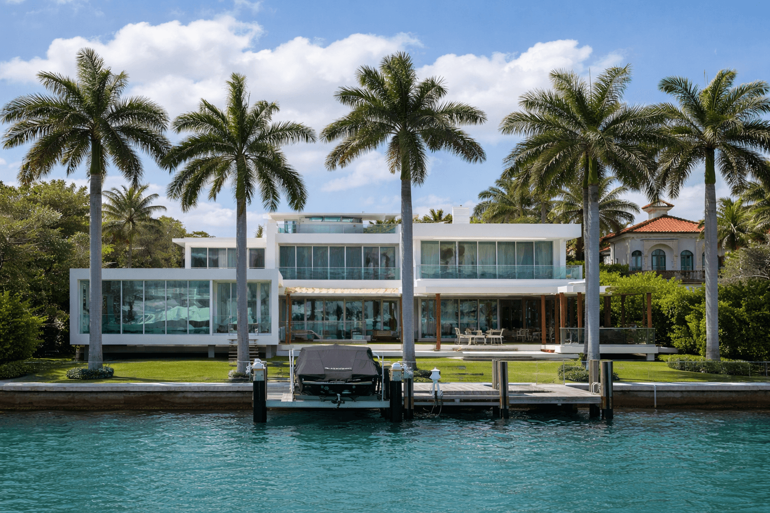 woman holding a phone and man looking at the phone. both are smiling