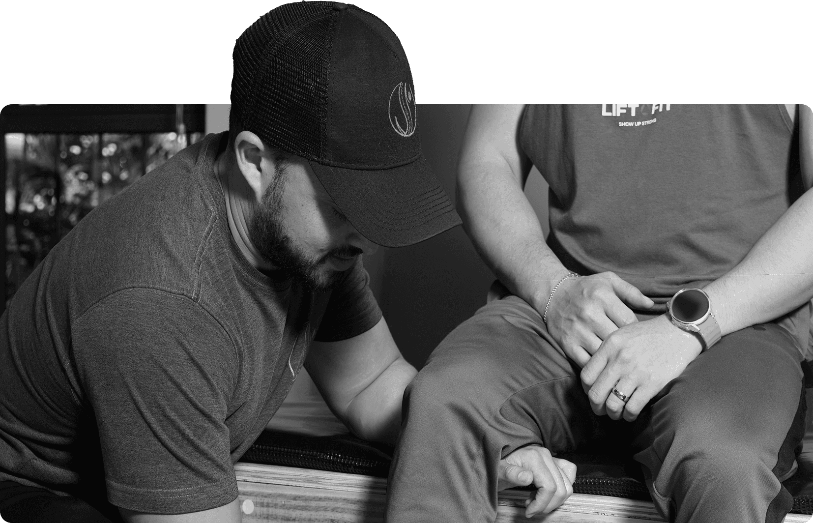 Biokineticist treating a client's knee during a rehabilitation session