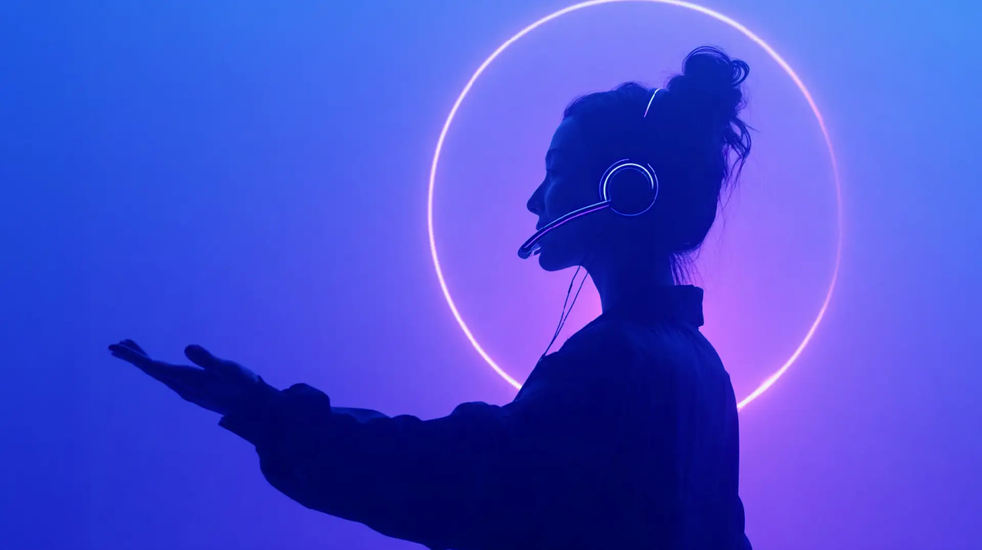 Person wearing a headset in front of a glowing ring