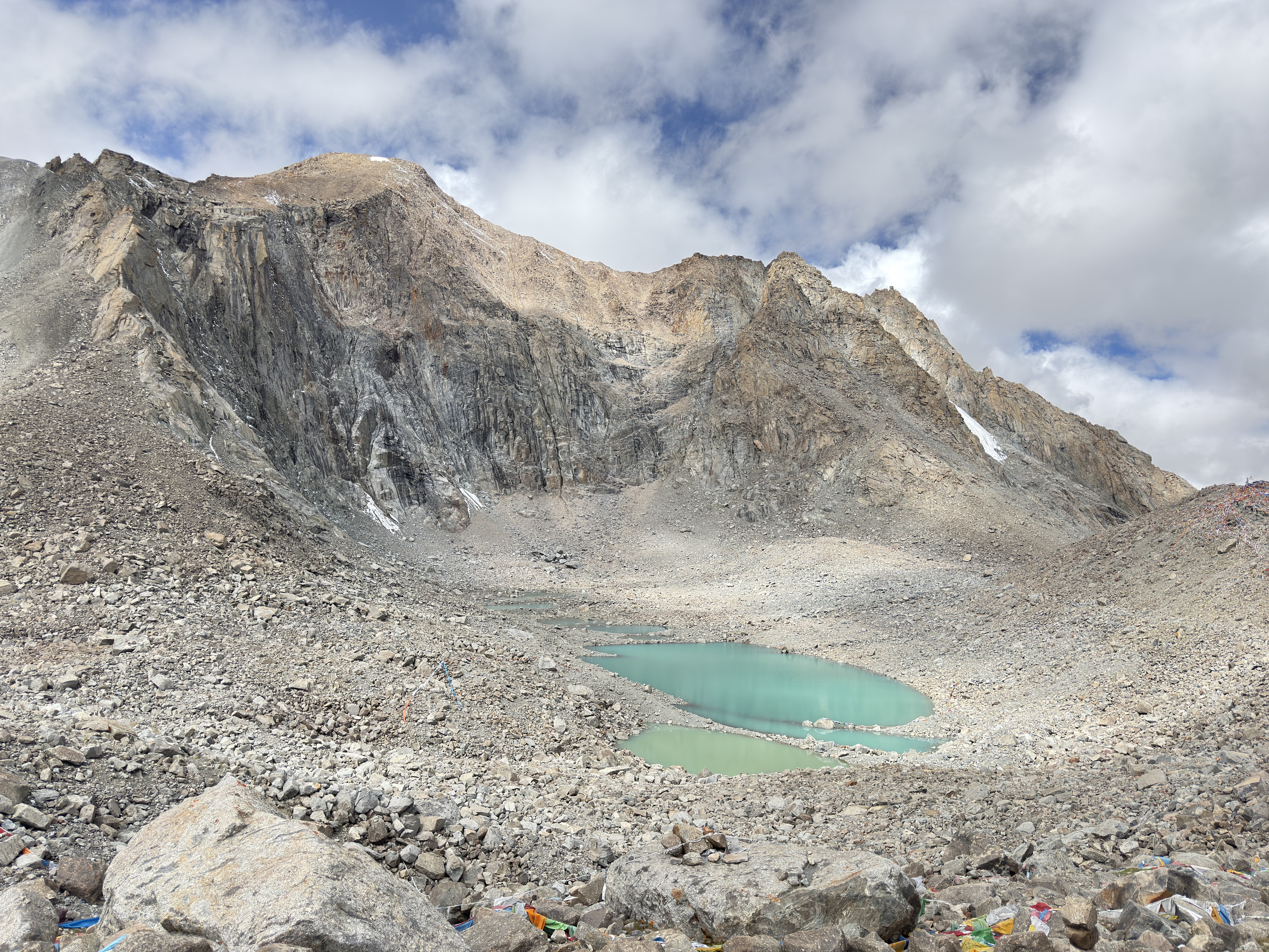blue lake in the middle of rocky mountains