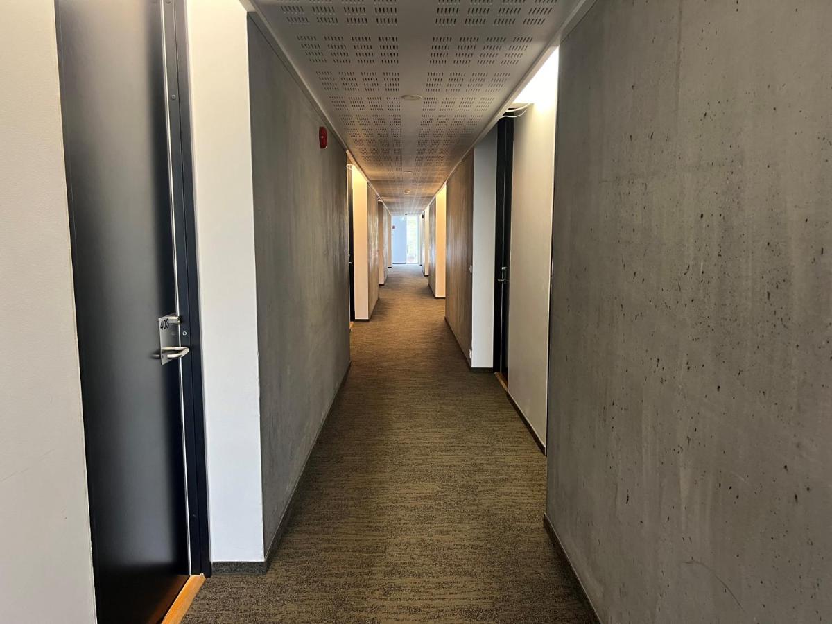 Functional and bright Triple Room setup at Hotel Bifrös