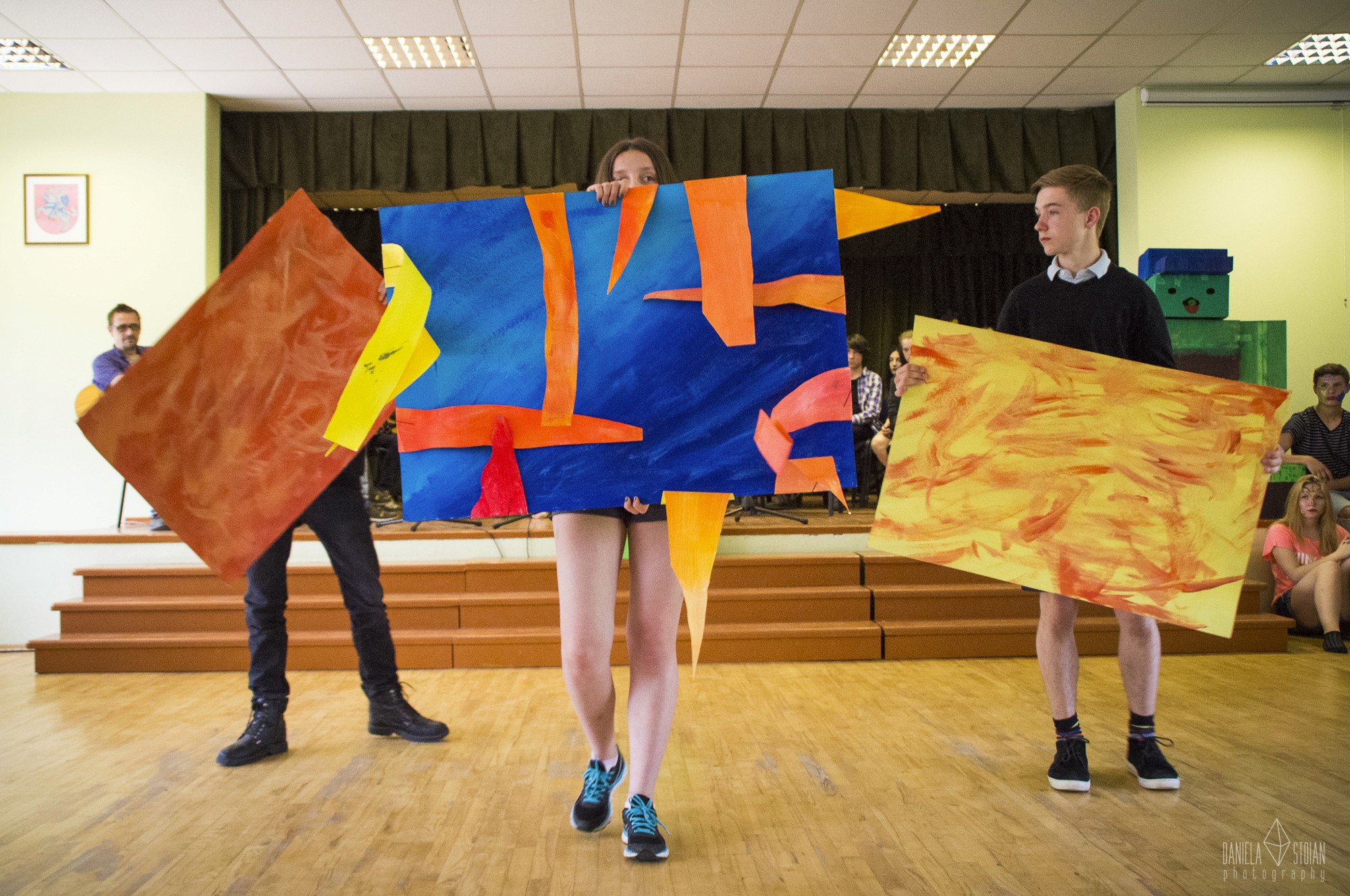 person holding pink and white heart print paper