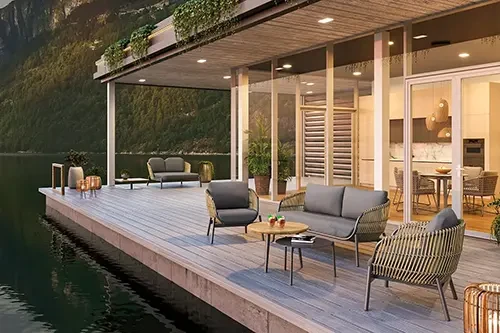 Stylish Nathan COCO outdoor garden furniture set on a lakeside deck.