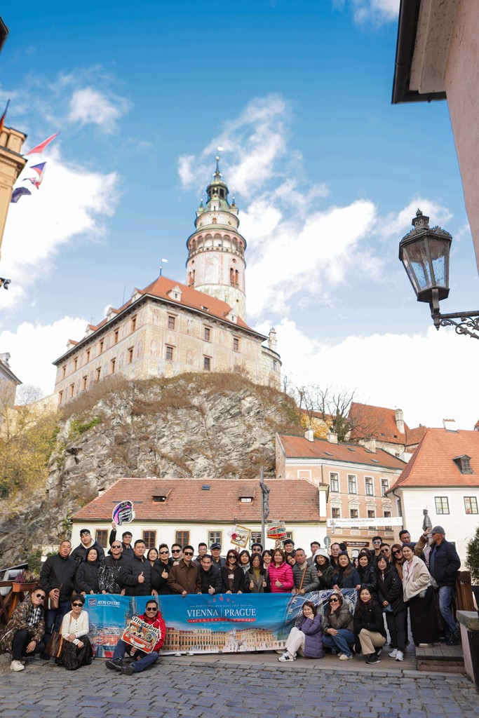 A travel group together in a historic town
