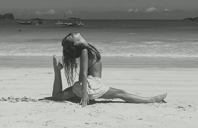 Shirtless man meditating indoors