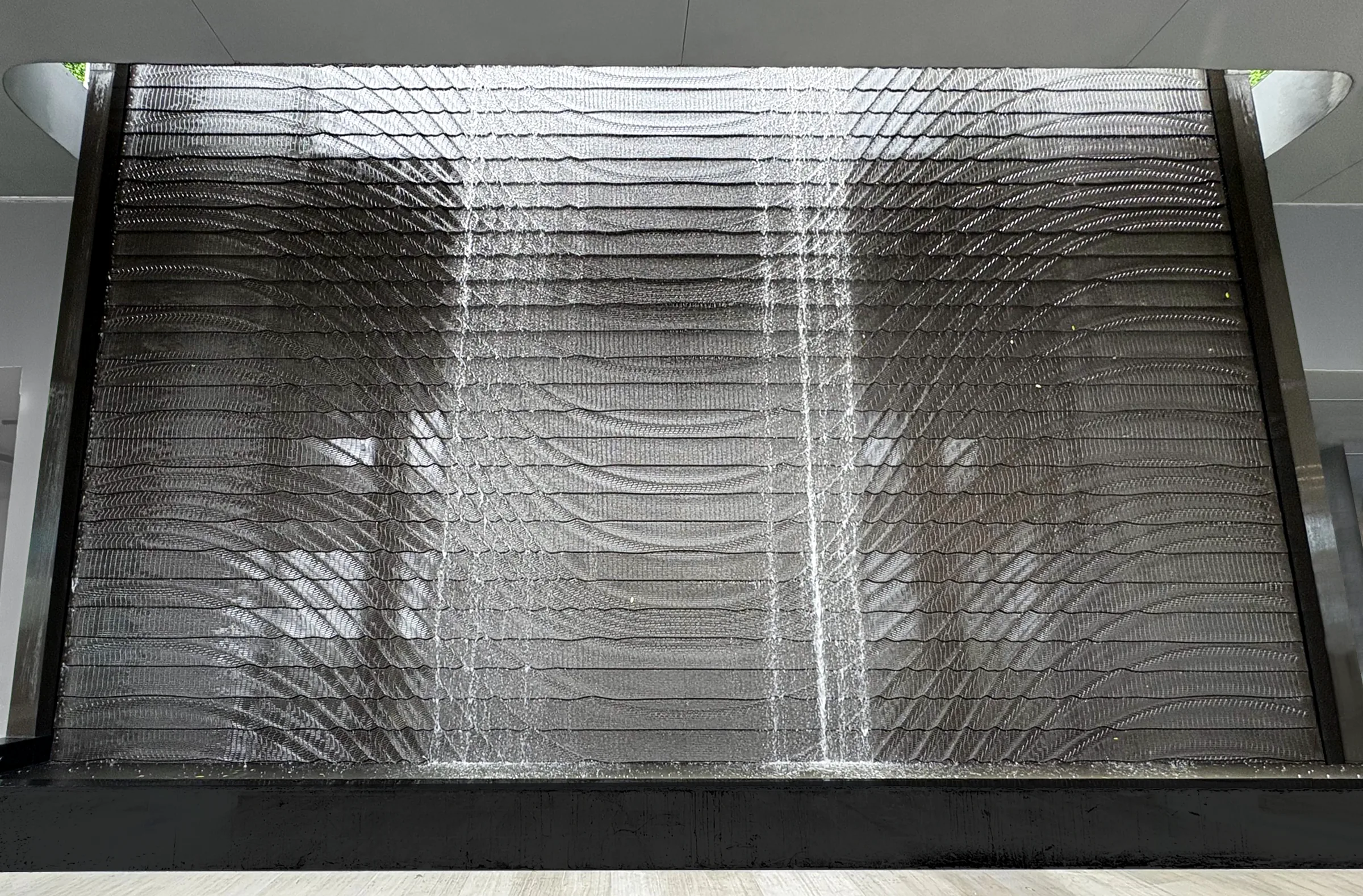 Backlit casino ceiling with the shape of flowing cubes